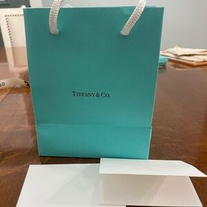 Empty Tiffany & Co. presentation bag and card